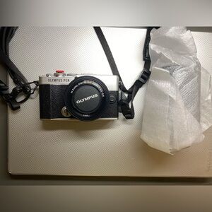 Olympus PEN EP7 Black and Silver Camera, with 14-42 mm And 40-150 mm lenses